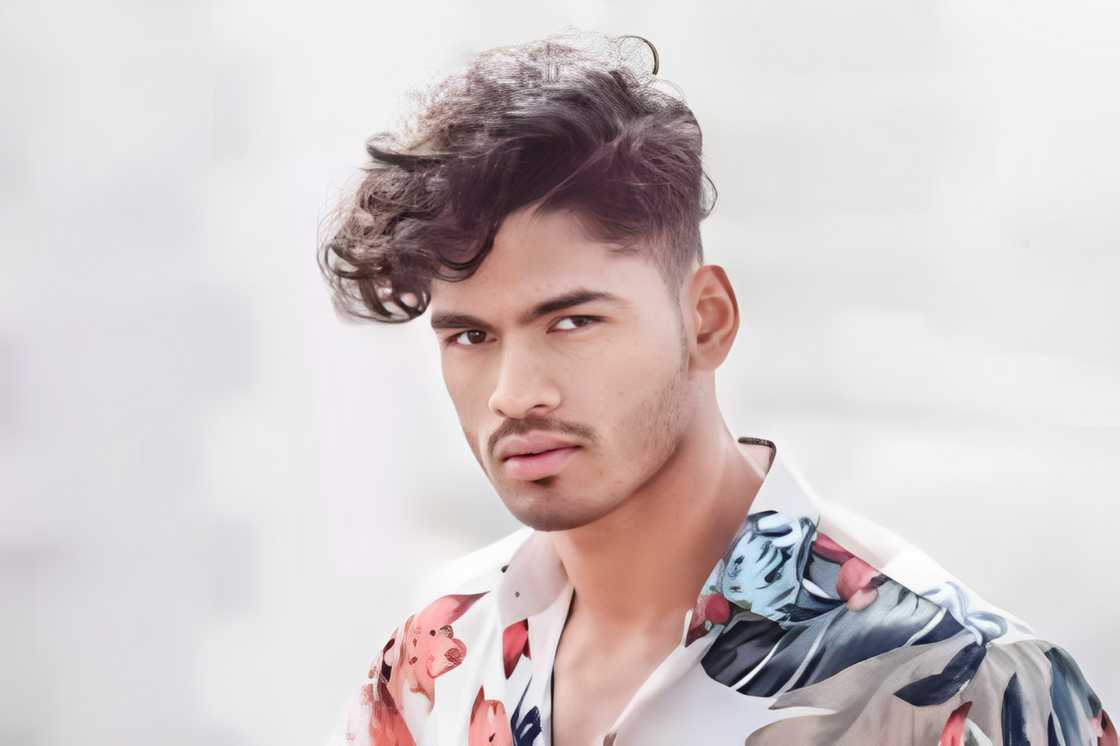 A man with a long textured haircut