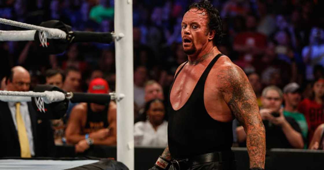 The Undertaker recovers during his fight against Brock Lesner at the WWE SummerSlam 2015 at Barclays Center of Brooklyn on August 23, 2015 in New York City. (Photo by JP Yim/Getty Images) The Undertaker recovers during his fight against Brock Lesner at the WWE SummerSlam 2015 at Barclays Center of Brooklyn on August 23, 2015 in New York City. (Photo by JP Yim/Getty Images)