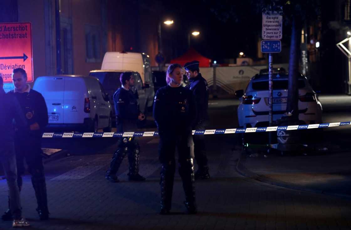 Officers stand guard at the scene of a fatal knife attack on police in Brussels