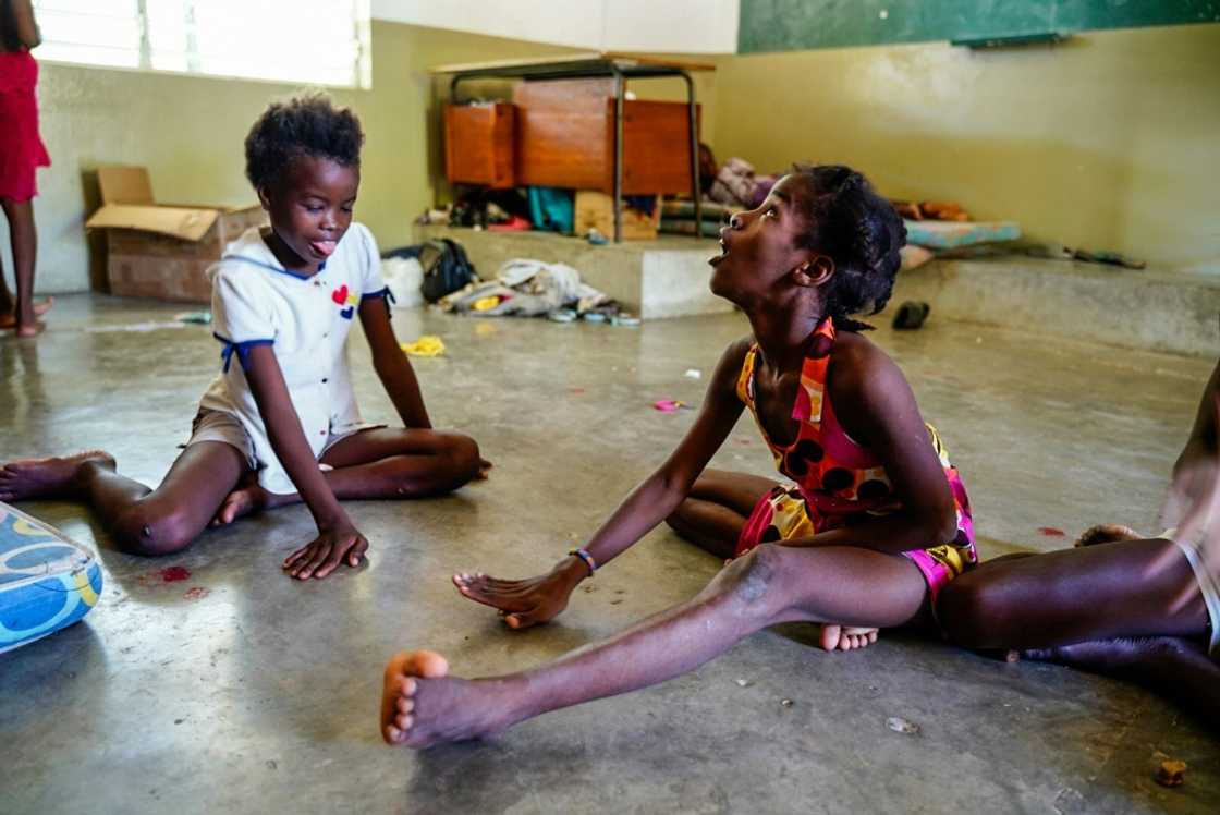 Children who have fled gang violence shelter in a Catholic school in Haiti's capital Port-au-Prince Children who have fled gang violence shelter in a Catholic school in Haiti's capital Port-au-Prince