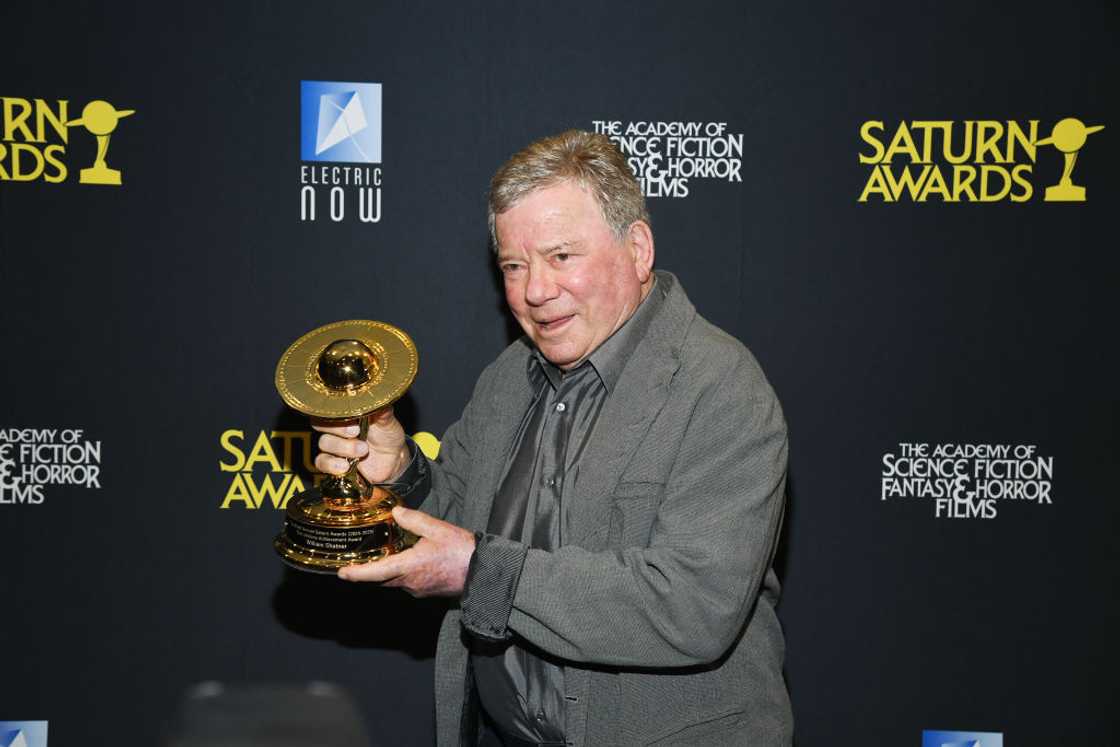 William Shatner holding an award William Shatner holding an award