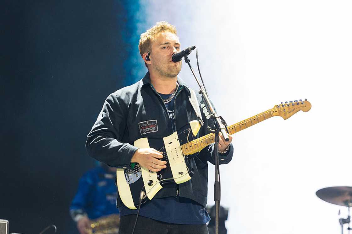 Sam Fender performing on stage Sam Fender performing on stage
