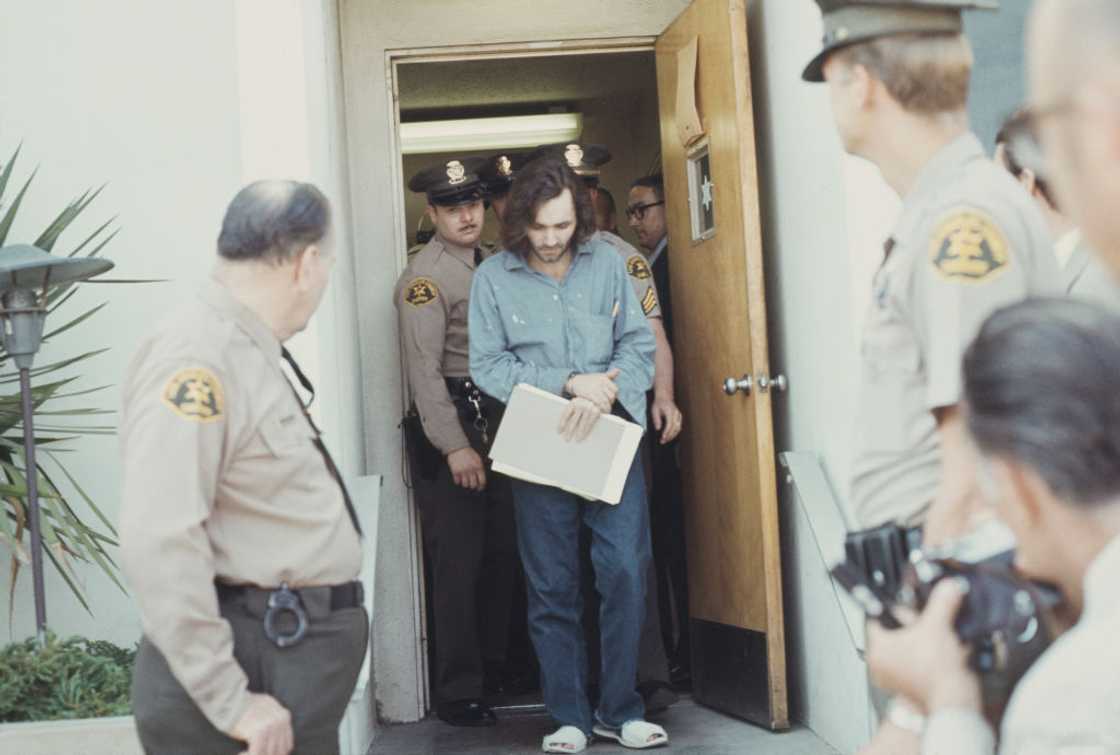 Charles Manson escorted by the police on the way to court. Charles Manson escorted by the police on the way to court.