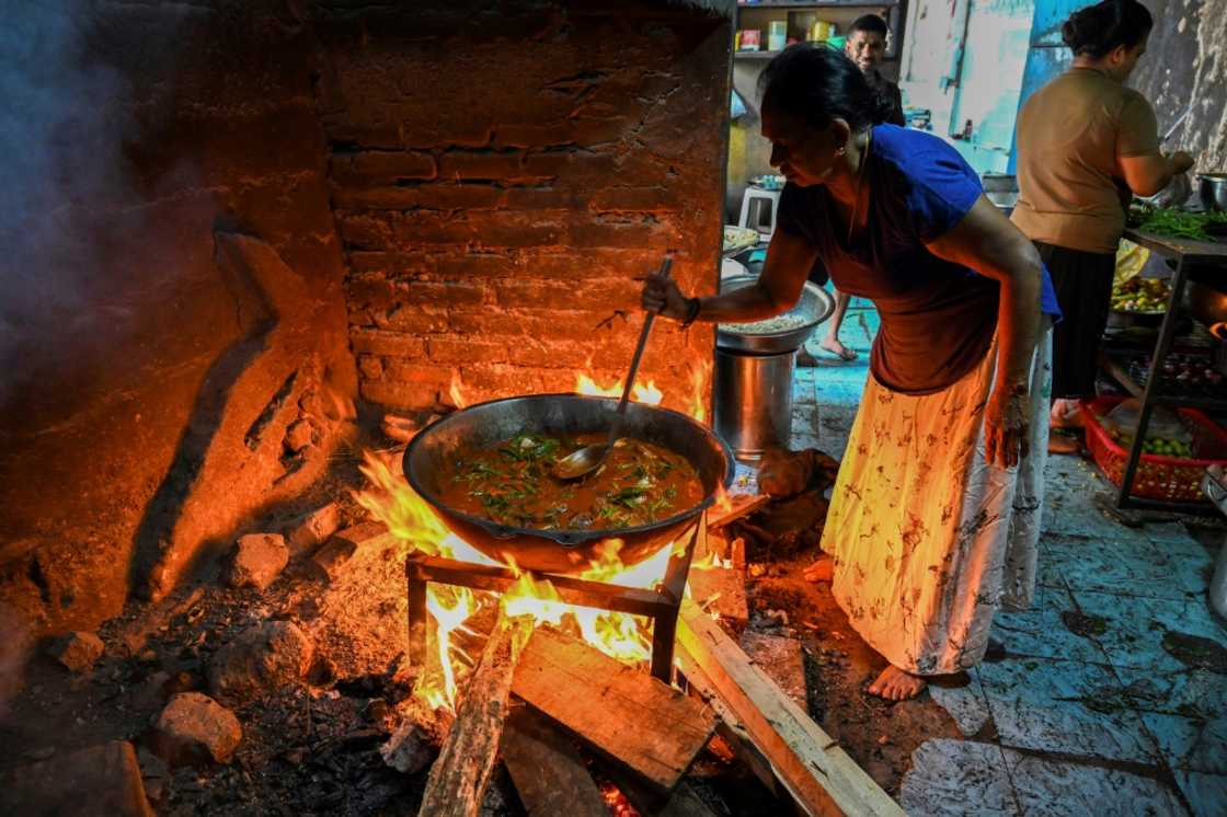 With gas prices soaring in the struggling nation, many Sri Lankans have been forced to revert to cooking with firewood With gas prices soaring in the struggling nation, many Sri Lankans have been forced to revert to cooking with firewood