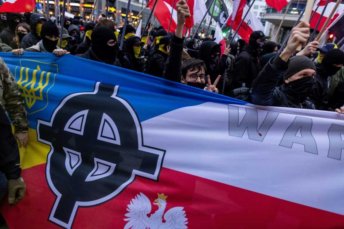 Marchers sang the national anthem and set off fireworks and smoke torches Marchers sang the national anthem and set off fireworks and smoke torches