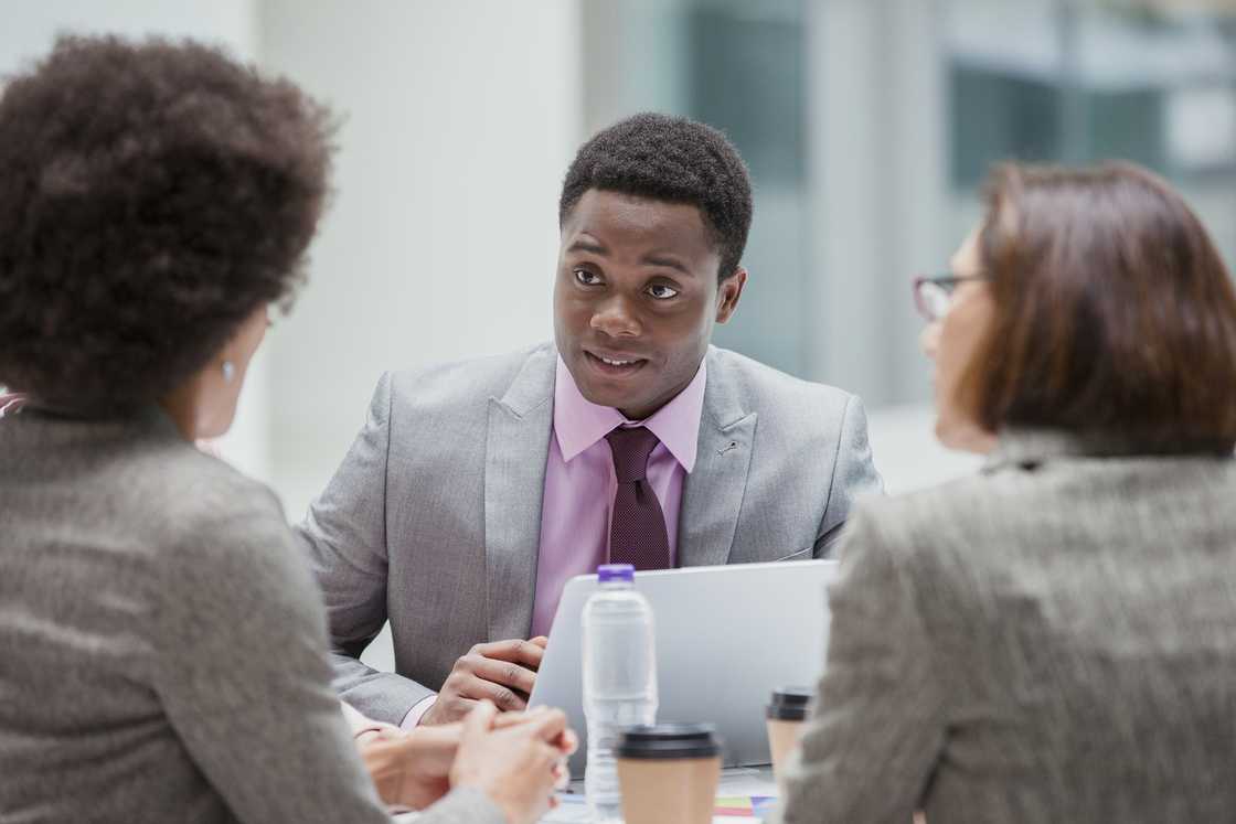 A young man at a work event