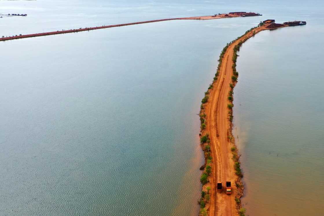 Trucks transport soil containing nickel ore in Pomalaa in southeast Sulawesi Trucks transport soil containing nickel ore in Pomalaa in southeast Sulawesi
