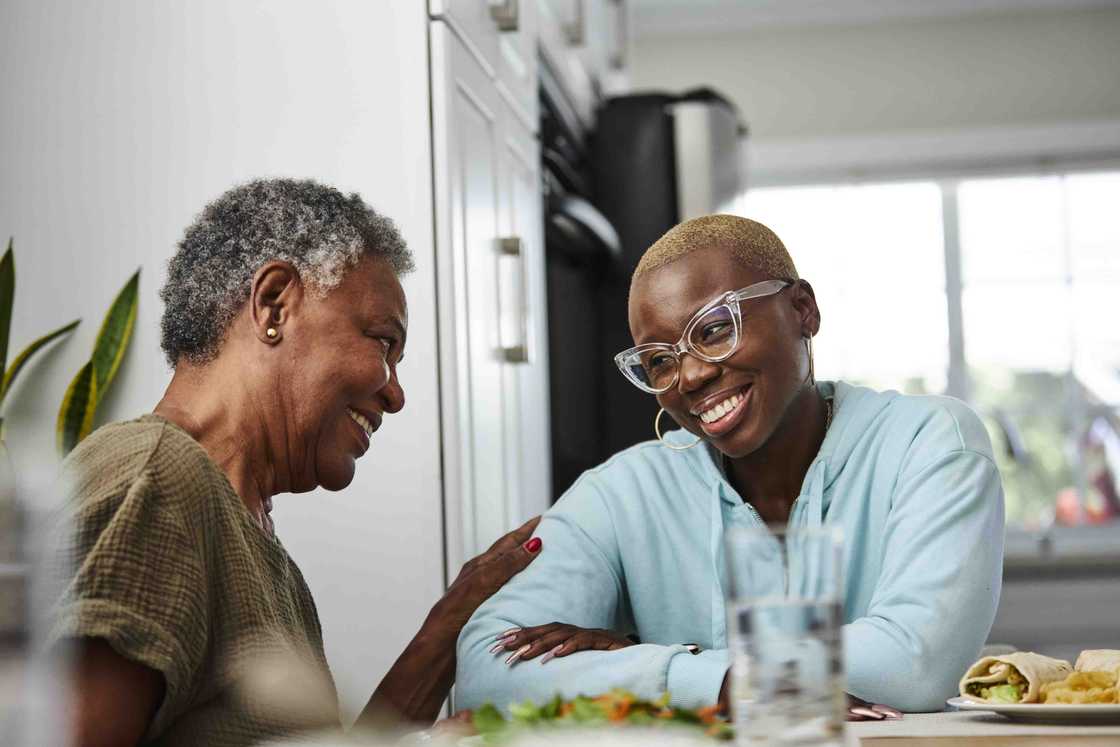 Two women chattin at the dinning table