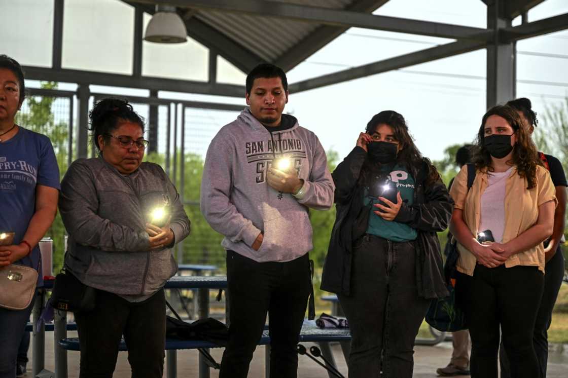 People take part in a vigil for 51 migrants who died in a tractor trailer truck in Texas People take part in a vigil for 51 migrants who died in a tractor trailer truck in Texas