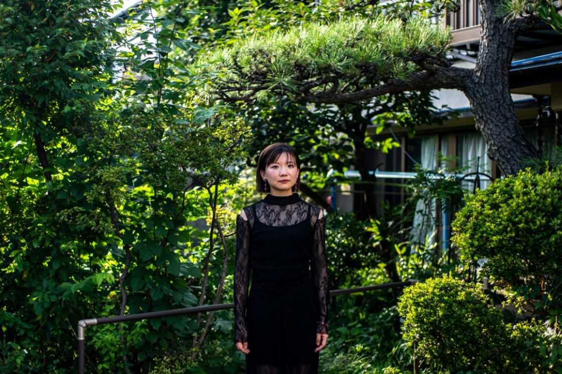 Aya Takeshima's recent show at Tokyo Fashion Week for her brand Ayame featured women wearing sheer blouses and men in delicate dresses Aya Takeshima's recent show at Tokyo Fashion Week for her brand Ayame featured women wearing sheer blouses and men in delicate dresses