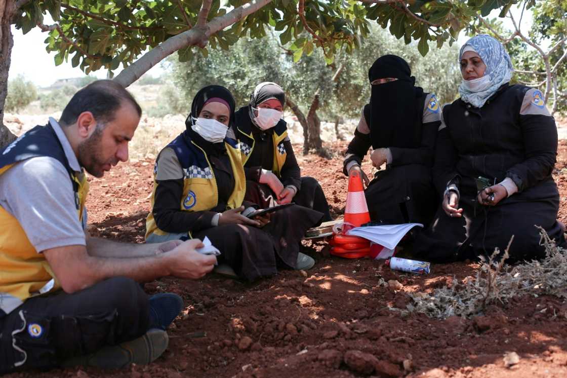 Members of the Syrian civil defence group the White Helmets and volunteers take part in a course on how to locate and neutralise unexploded ordnance Members of the Syrian civil defence group the White Helmets and volunteers take part in a course on how to locate and neutralise unexploded ordnance