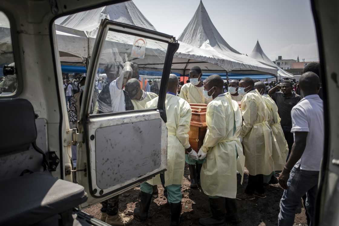 Health workers carry the coffin of an activist killed during a demonstration against UN peacekeepers last week Health workers carry the coffin of an activist killed during a demonstration against UN peacekeepers last week