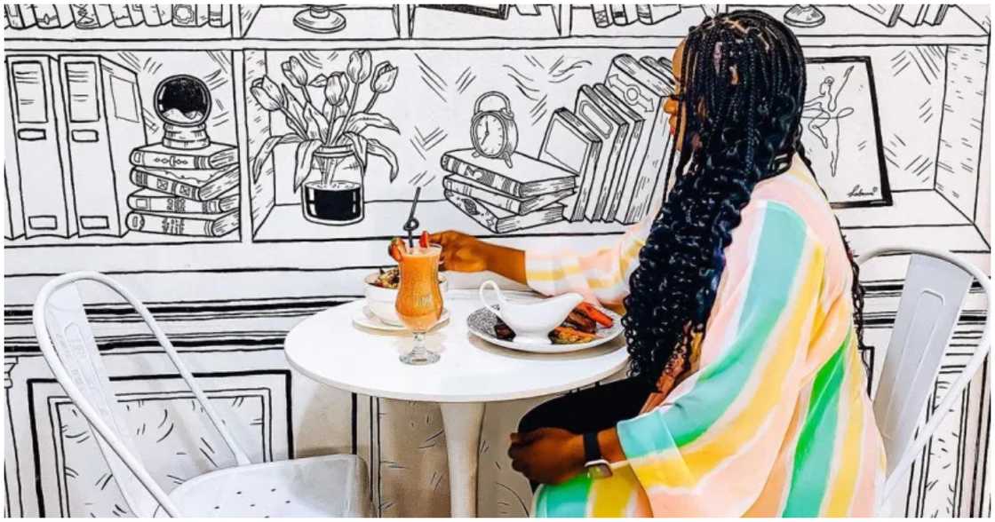 A woman enjoying her food at Sketch Restaurant