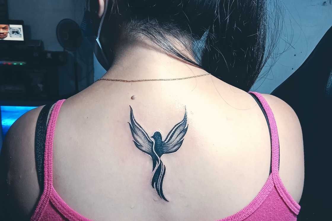 feminine rebirth phoenix tattoo