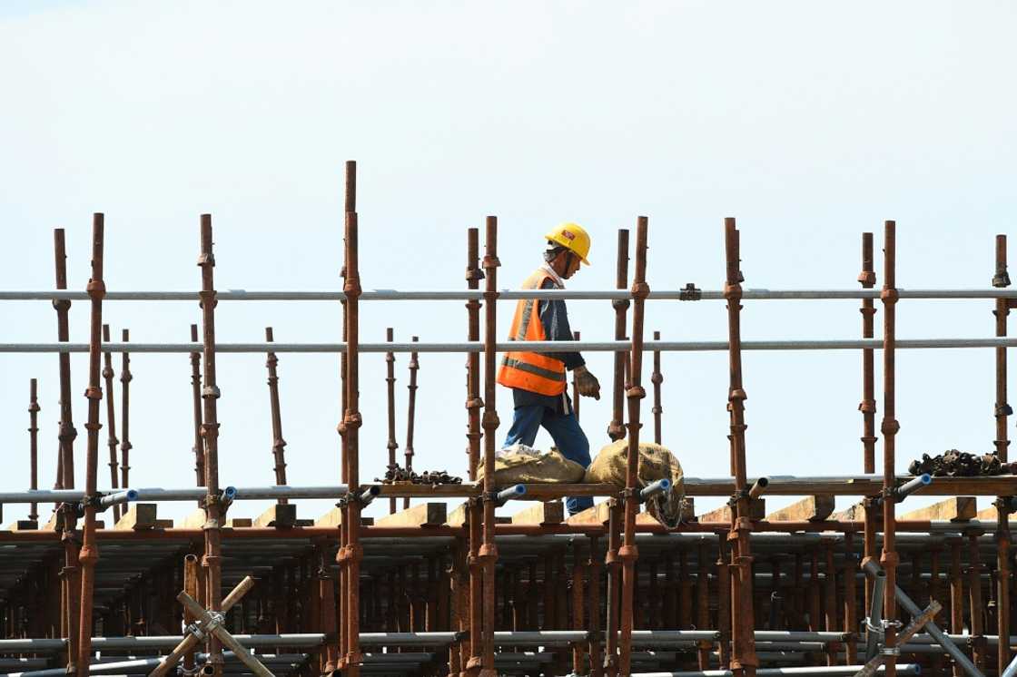 A Chinese laborer works at a construction site on reclaimed land in February 2020, part of a Chinese-funded project in Colombo, Sri Lanka A Chinese laborer works at a construction site on reclaimed land in February 2020, part of a Chinese-funded project in Colombo, Sri Lanka