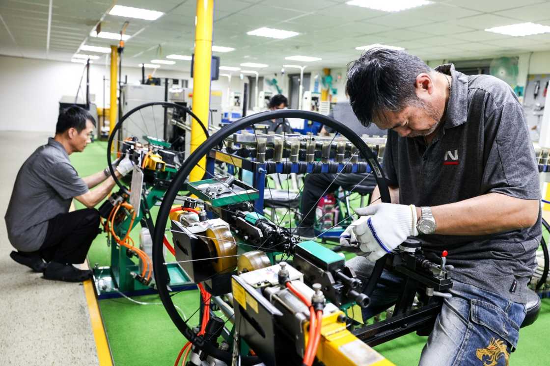 Workers check bicycle wheels at a Joy Group factory in Taichung on April 24, 2025 Workers check bicycle wheels at a Joy Group factory in Taichung on April 24, 2025