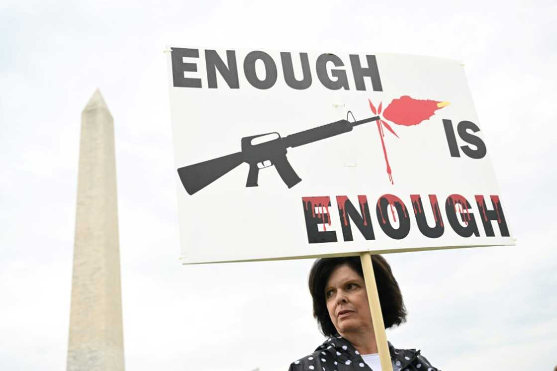 A gun control advocate holds a sign during a June 11, 2022 protest in Washington, DC that was organized by March for Our Lives A gun control advocate holds a sign during a June 11, 2022 protest in Washington, DC that was organized by March for Our Lives