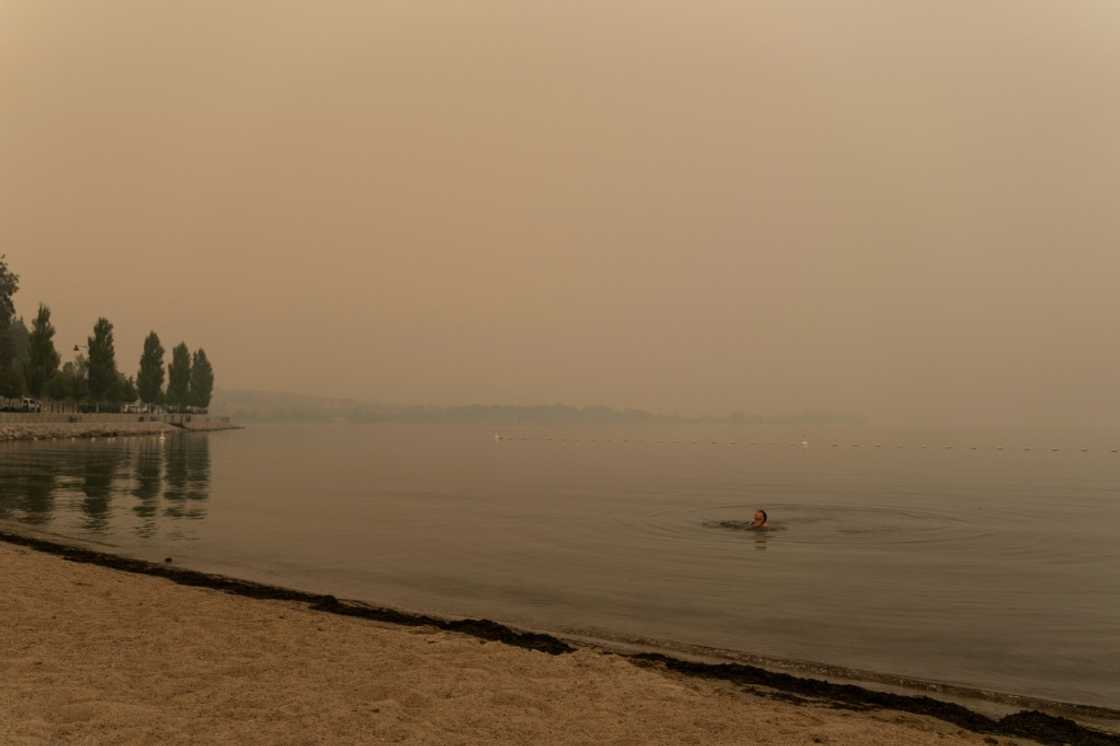 A woman swims in Lake Okanagan covered in wildfires smoke in West Kelowna A woman swims in Lake Okanagan covered in wildfires smoke in West Kelowna