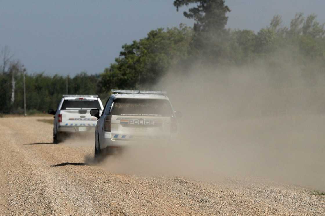 Police vehicles patrol James Smith Cree Nation reserve in Canada following a possible sighting of a fugitive suspected in the stabbings that occurred there and in the town of Weldon Police vehicles patrol James Smith Cree Nation reserve in Canada following a possible sighting of a fugitive suspected in the stabbings that occurred there and in the town of Weldon