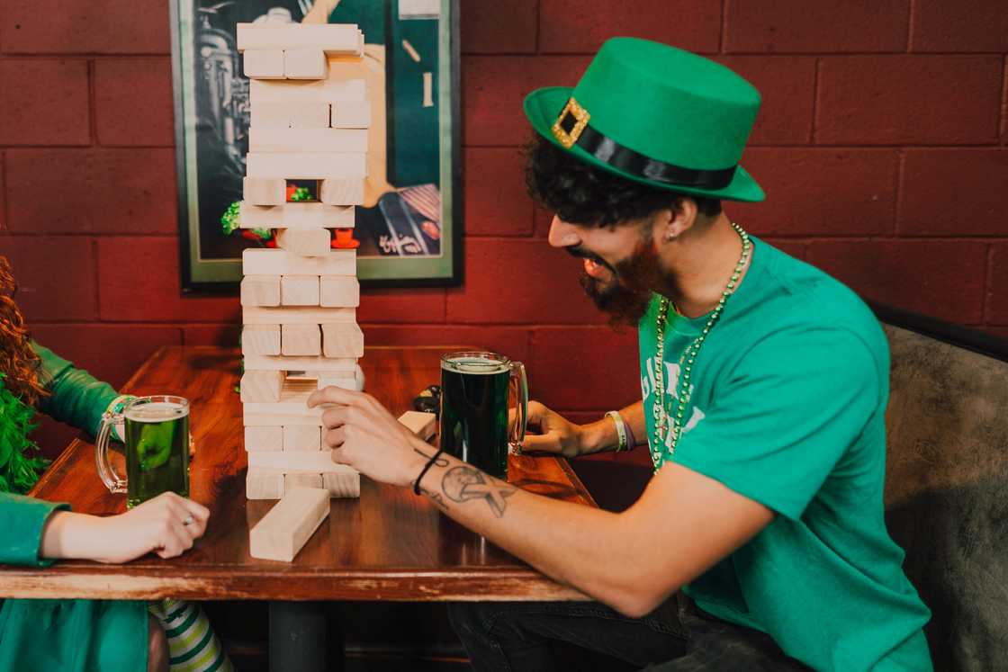 Two men playing Drunk Jenga