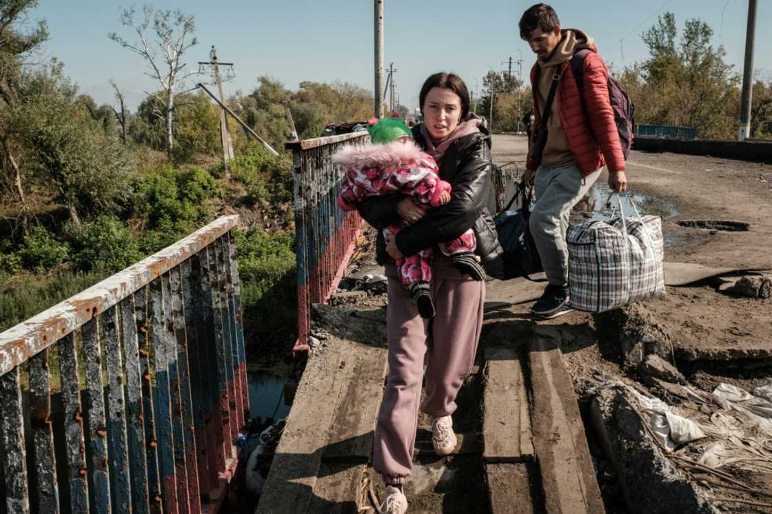 Civilians needed to cross a heavily damaged bridge across the Oskil River in Kupiansk on foot to move away from the front lines Civilians needed to cross a heavily damaged bridge across the Oskil River in Kupiansk on foot to move away from the front lines