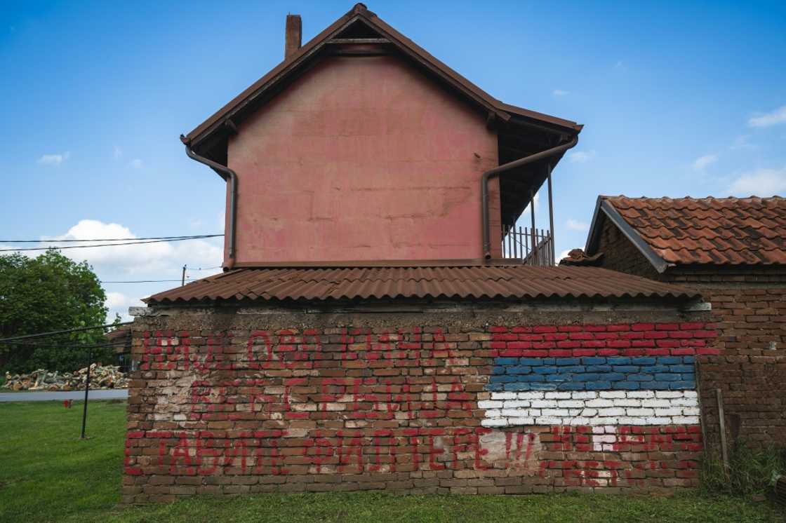 Graffiti on a house close to the Chinese steel mill in Serbia says, "This is not China, this is Serbia. Install (chimney) filters!"