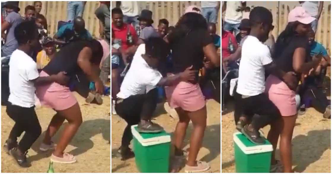 Diminutive man struggles to dance with tall lady. Diminutive man struggles to dance with tall lady.