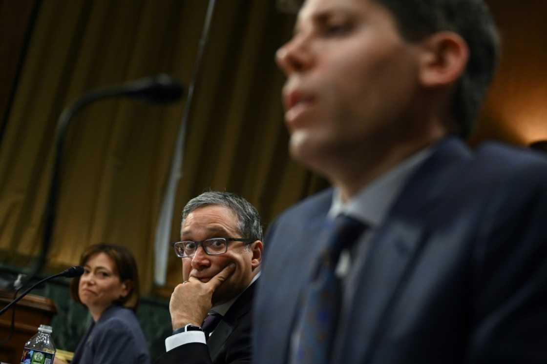 Christina Montgomery, Chief Privacy and Trust Officer at IBM, and Gary Marcus, Professor Emeritus at New York University, look on as Samuel Altman, CEO of OpenAI, testifies during a Senate Judiciary panel Christina Montgomery, Chief Privacy and Trust Officer at IBM, and Gary Marcus, Professor Emeritus at New York University, look on as Samuel Altman, CEO of OpenAI, testifies during a Senate Judiciary panel