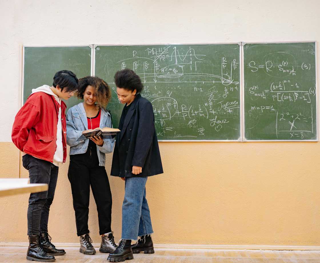 Multiethnic students studying together inside a classroom