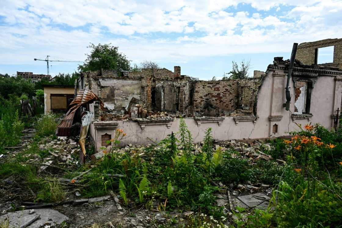 'Win war first, then rebuild,' say residents of shattered Bucha 'Win war first, then rebuild,' say residents of shattered Bucha