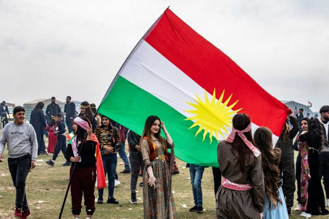 Syrian Kurds celebrate their Nowruz New Year on March 21, 2022 in Qahtaniyah in the northeastern Hasakah province close to the border with Turkey Syrian Kurds celebrate their Nowruz New Year on March 21, 2022 in Qahtaniyah in the northeastern Hasakah province close to the border with Turkey