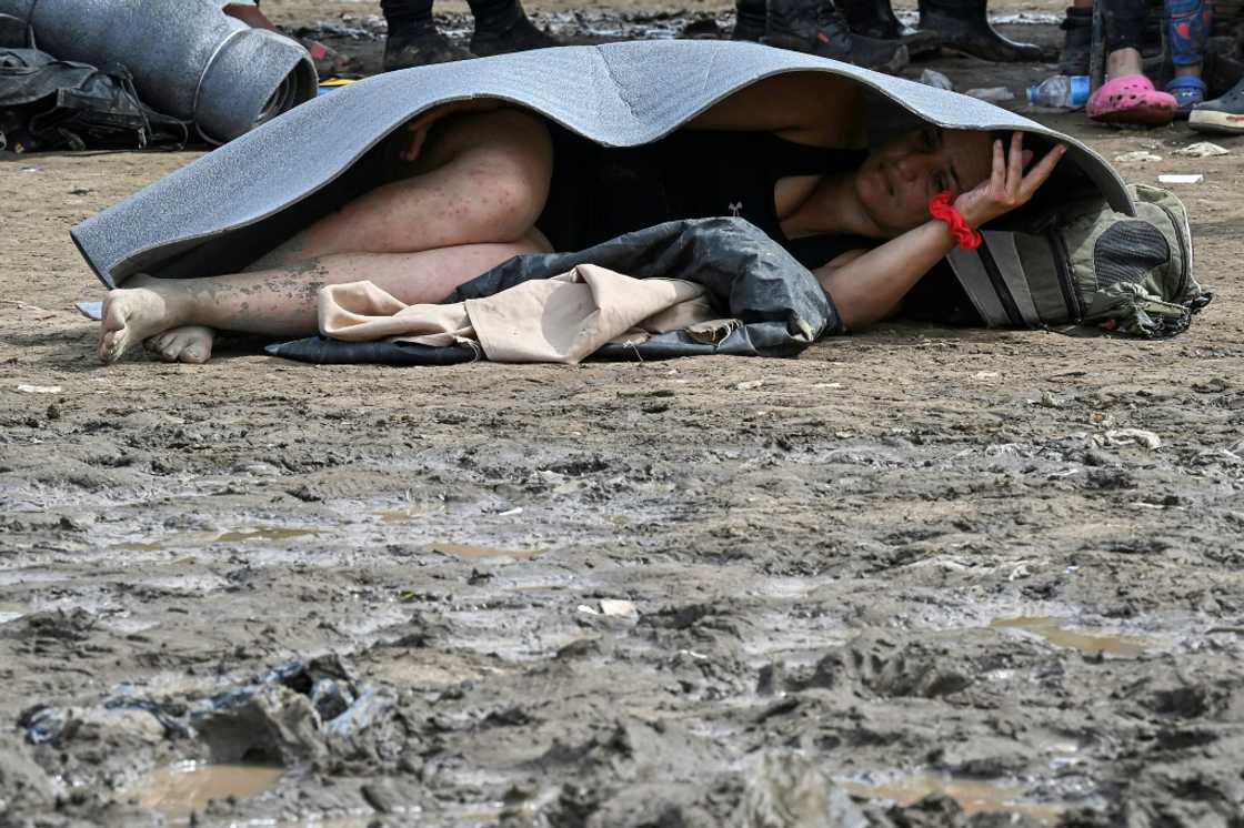 A Venezuelan migrant rests on the ground in Canaan Membrillo village A Venezuelan migrant rests on the ground in Canaan Membrillo village