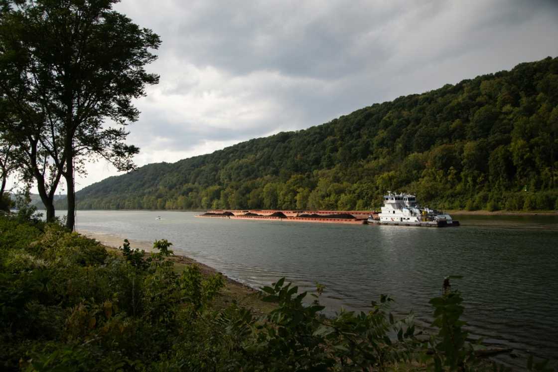 A coal barge is seen along the Monongahela River in Monongahela, Washington County