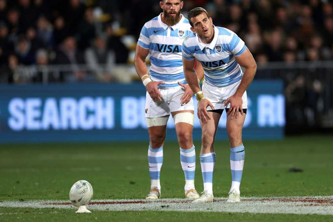Argentine Emiliano Boffelli (R) prepares to kick a penalty against New Zealand in Christchurch on August 27, 2022, with teammate Marcos Kremer watching. Argentine Emiliano Boffelli (R) prepares to kick a penalty against New Zealand in Christchurch on August 27, 2022, with teammate Marcos Kremer watching.