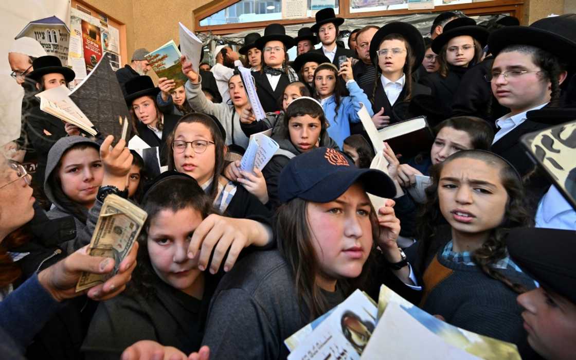 Children of Hasidic Jewish pilgrims leave after praying at Rabbi Nachman's tomb as they mark Rosh Hashana, the Jewish new year, in Uman, some 200km from Kyiv