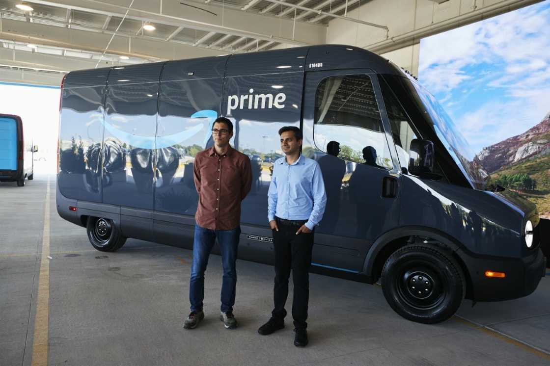 Rivian says it has rolled out specially designed electric delivery vehicles with Amazon in more than a dozen US cities as part of an effort by the e-commerce giant to be more climate friendly Rivian says it has rolled out specially designed electric delivery vehicles with Amazon in more than a dozen US cities as part of an effort by the e-commerce giant to be more climate friendly