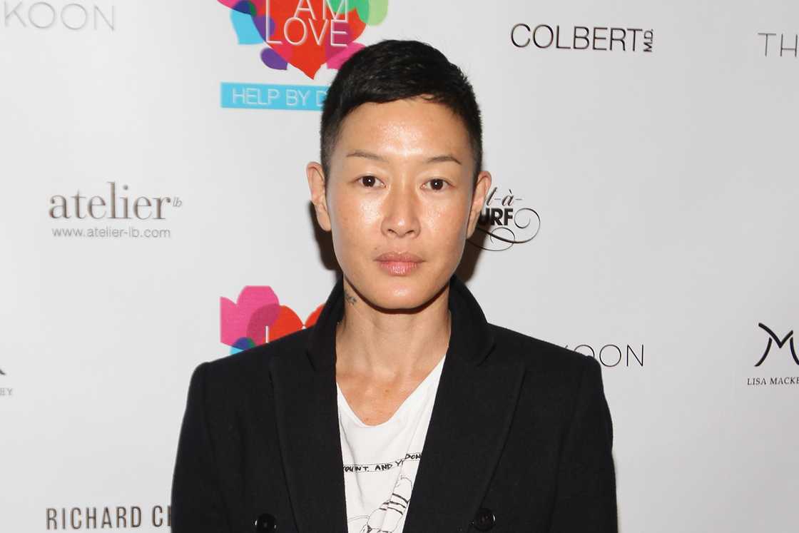 Jenny Shimizu poses next to a barner in New York City