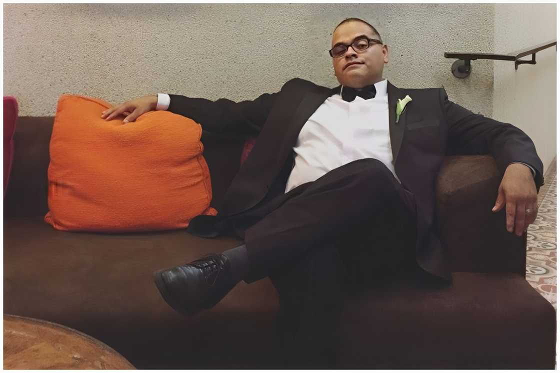 David Moses seated on a couch David Moses seated on a couch