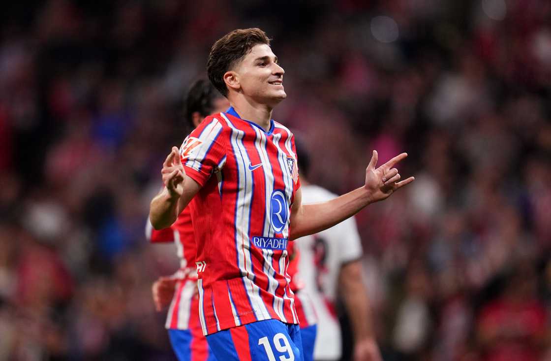 Julian Alvarez of Atletico de Madrid celebrates scoring his team's third goal during the LaLiga match between Atletico de Madrid and Rayo Vallecano at Riyadh Air Metropolitano on April 24, 2025 in Madrid, Spain Julian Alvarez of Atletico de Madrid celebrates scoring his team's third goal during the LaLiga match between Atletico de Madrid and Rayo Vallecano at Riyadh Air Metropolitano on April 24, 2025 in Madrid, Spain