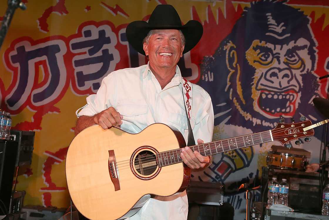 George Strait performs in concert during Ray Benson's 65th birthday party