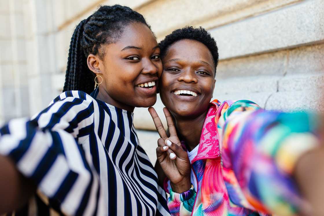 Two best friends are taking a selfie Two best friends are taking a selfie
