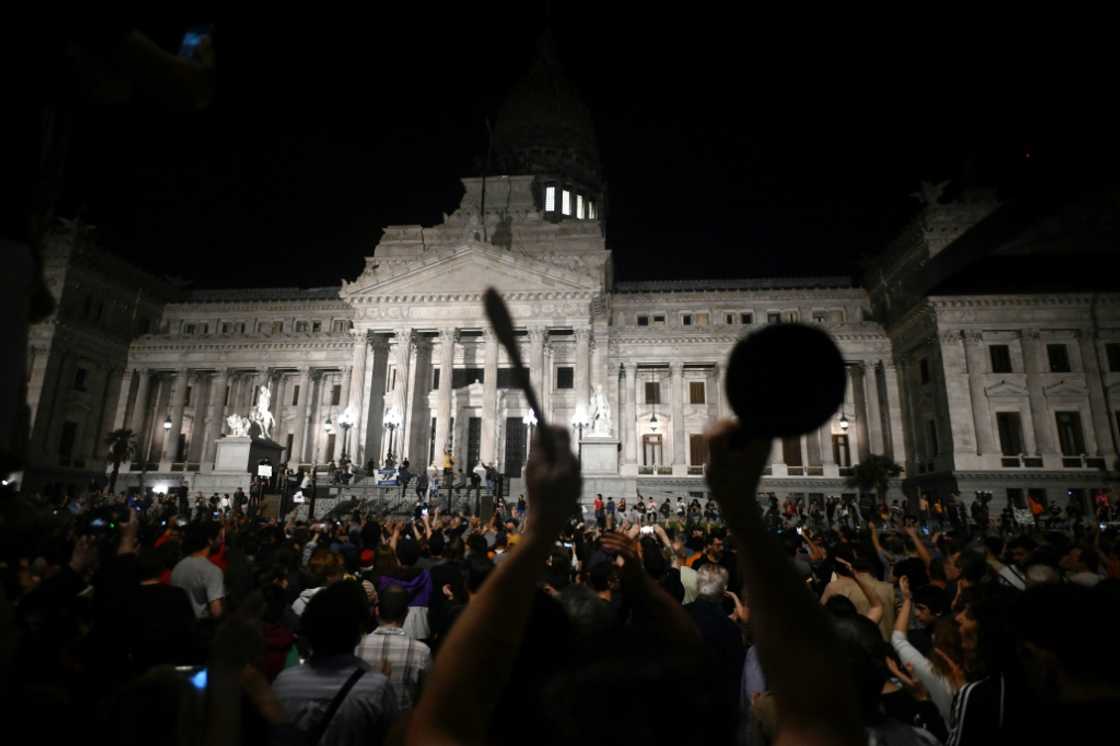 People bang pans and pots during a demonstration against the new government of Argentine President Javier Milei in front of the National Congress People bang pans and pots during a demonstration against the new government of Argentine President Javier Milei in front of the National Congress