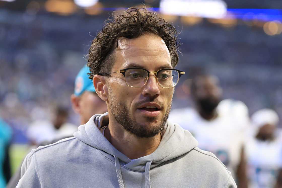 Mike McDaniel of the Miami Dolphins runs off the field at halftime against the Indianapolis Colts