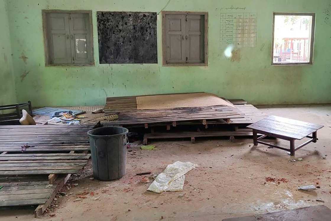 Debris and bloodstains are seen on the floor of aschool building in Depeyin township in Myanmar's northwest Sagaing region on September 17, 2022 after an attack by a military helicopter Debris and bloodstains are seen on the floor of aschool building in Depeyin township in Myanmar's northwest Sagaing region on September 17, 2022 after an attack by a military helicopter