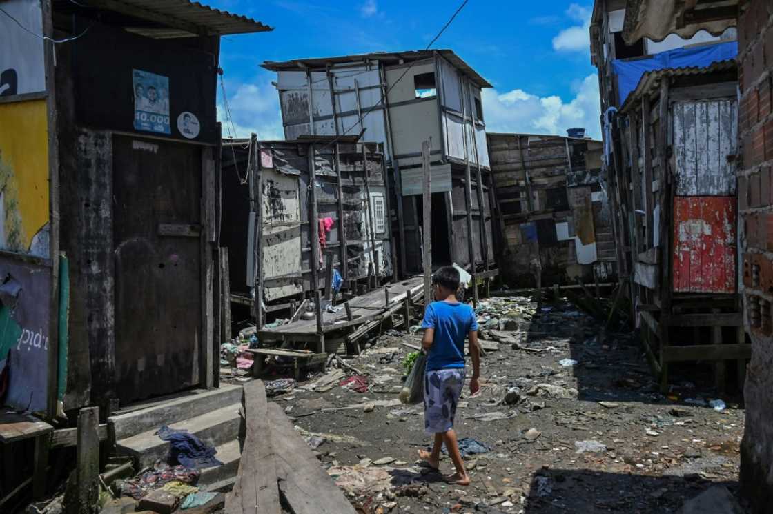 Children are among the worst affected by extreme poverty, which is rising across Latin America and the Caribbean. Here, a child walks through a favela in northeastern Brazil. Children are among the worst affected by extreme poverty, which is rising across Latin America and the Caribbean. Here, a child walks through a favela in northeastern Brazil.