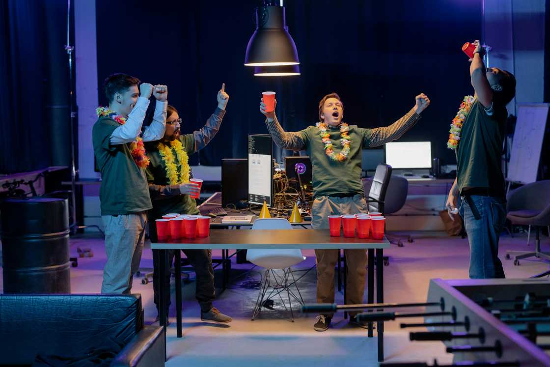 Men playing Beer Pong