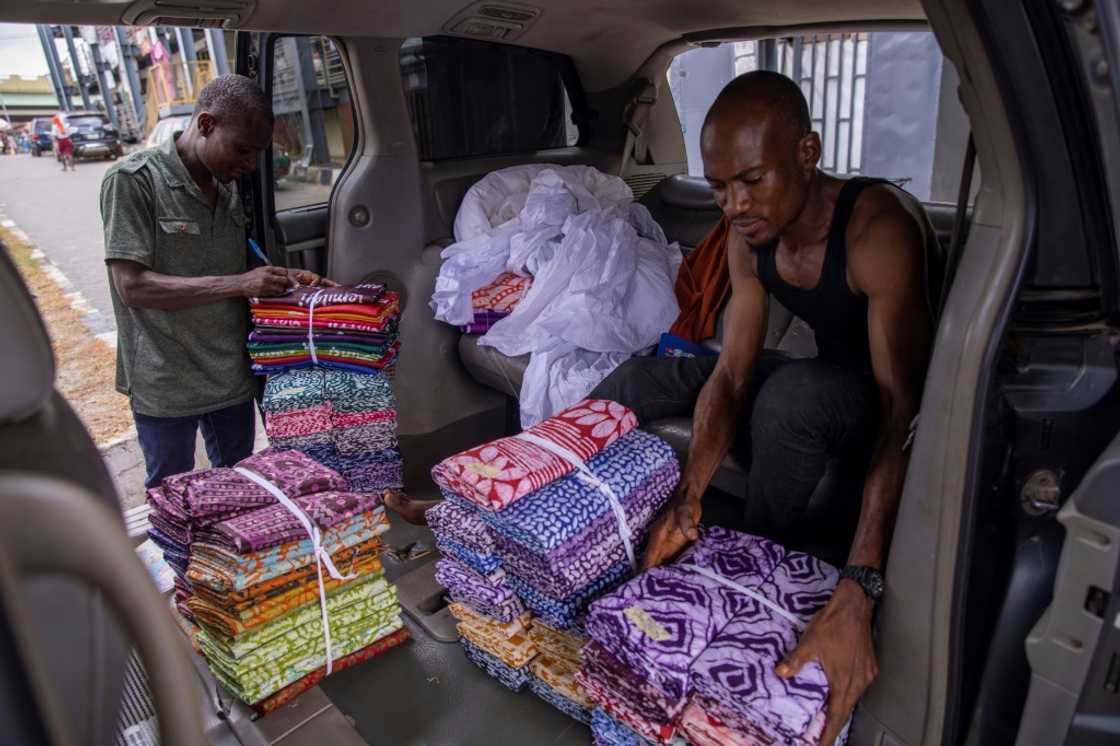 The cloth is knotted and folded by hand before being dyed to create colour gradients and shapes The cloth is knotted and folded by hand before being dyed to create colour gradients and shapes
