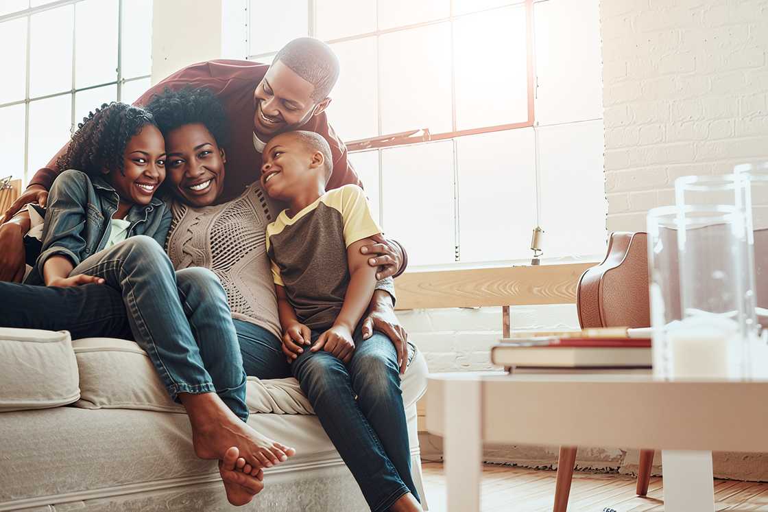 A black family on the sofa in their home A black family on the sofa in their home