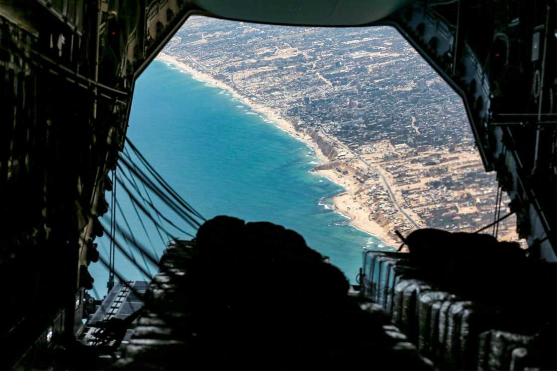 The cargo ramp of a German Air Force (Luftwaffe) A400M Atlas military transport aircraft is opened before releasing humanitarian aid pallets during an airdrop relief mission over the Gaza Strip on August 5, 2025 The cargo ramp of a German Air Force (Luftwaffe) A400M Atlas military transport aircraft is opened before releasing humanitarian aid pallets during an airdrop relief mission over the Gaza Strip on August 5, 2025