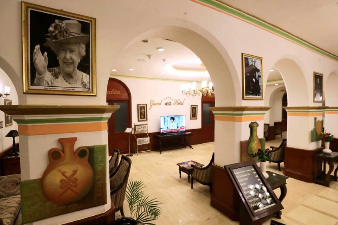 A portrait of Queen Elizabeth II still takes pride of place in Khartoum's colonial-era Grand Hotel where she stayed during a visit to Sudan in 1965 A portrait of Queen Elizabeth II still takes pride of place in Khartoum's colonial-era Grand Hotel where she stayed during a visit to Sudan in 1965